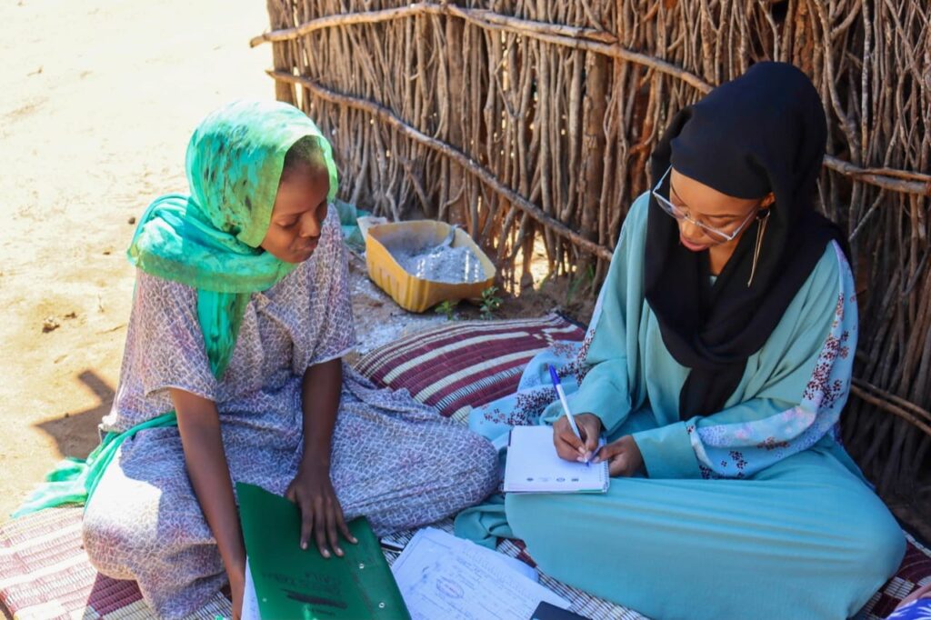 A KEMFSED Project officer interviews Zahra during a monitoring home visit